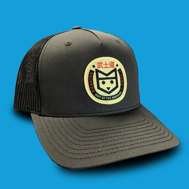 Bushido black trucker hat with yellow fox logo patch